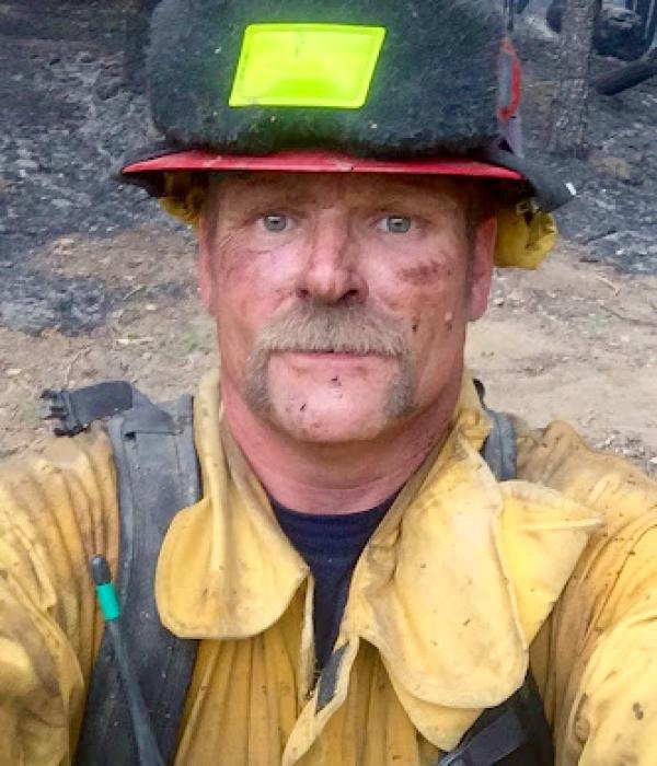 Brent Barlett in firefighter uniform