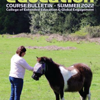 Cover of summer 2022 Extended Education bulletin depicting woman petting pony in pasture