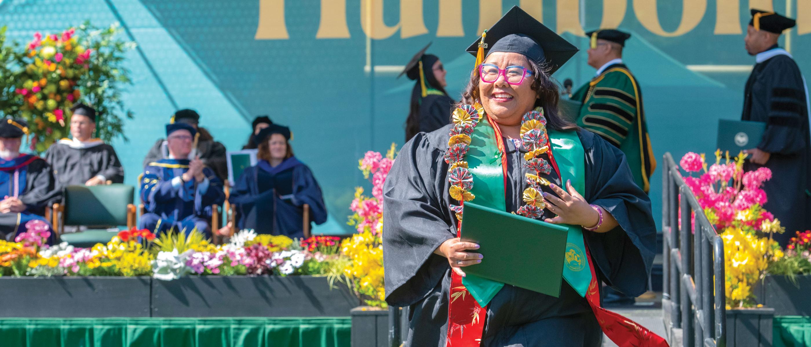 Happy graduate at Cal Poly Humboldt Commencement