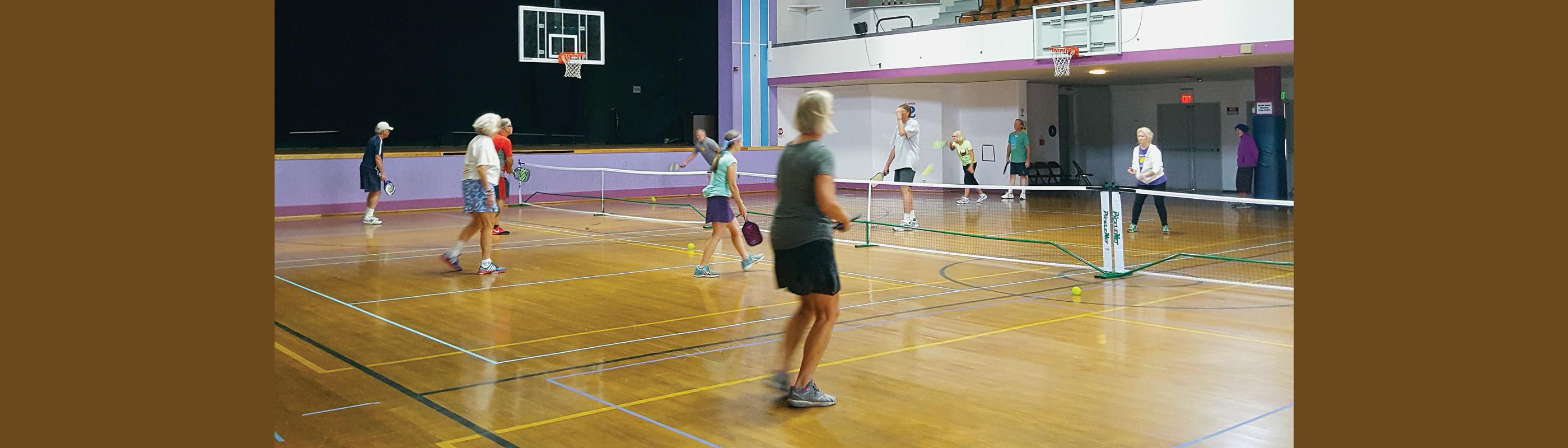 Pickleball players on a court