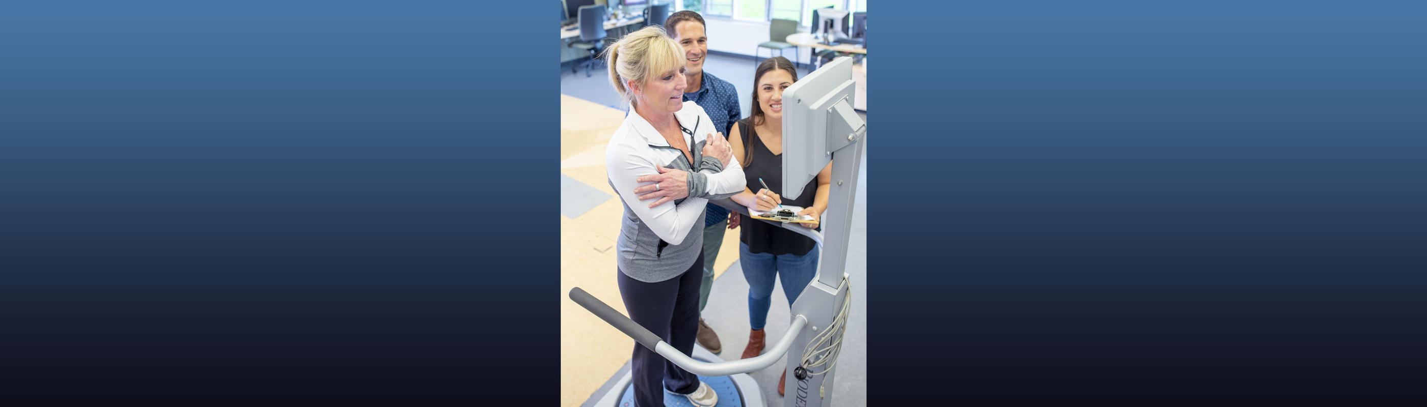 Woman getting a balance assessment