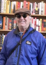 Gary Glassman in front of book shelf