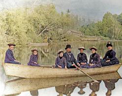 colorized historical photo of people in a canoe
