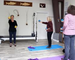 Instructor Summer Turner teaching in her Pilates studio